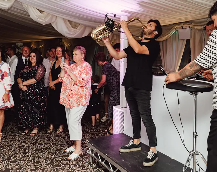 Guests gathered around the band as the evening begins