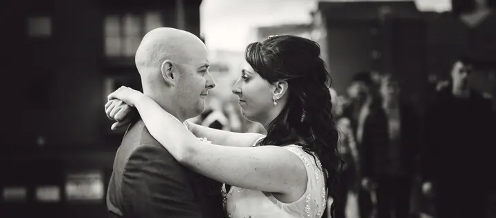 Black and white portrait of a couple embracing