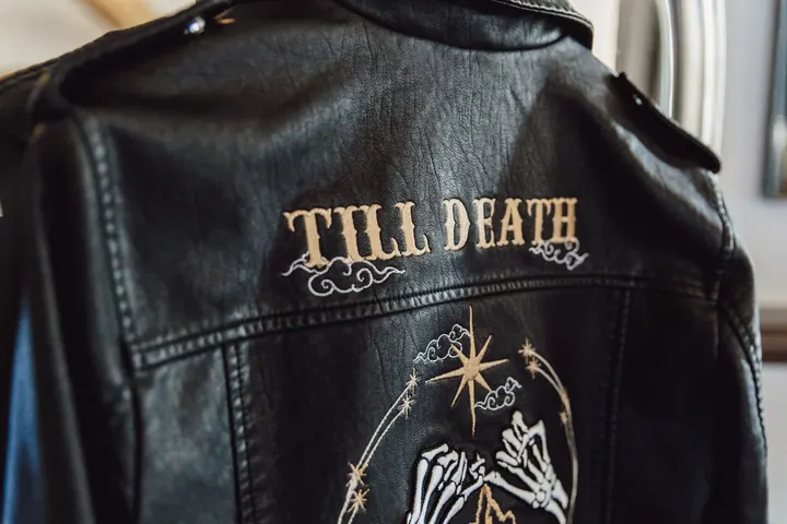 A bride’s leather jacket with Till Death embroidered across the back